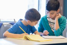 Two elementary students work together